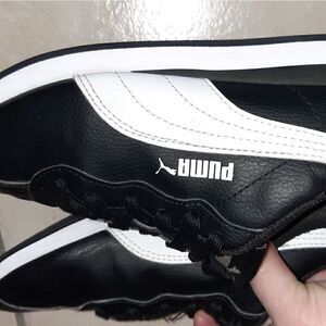 Black and white Pumas, size 4c